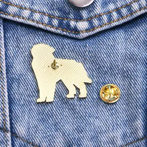 Golden shepherd dog enamel brooch pin with butterfly clutch on blue denim fabric
