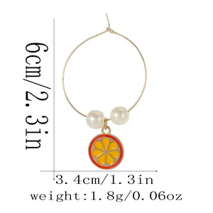 Golden alloy ring earring with lemon slice pendant and pearls, 6cm height and 3.4cm width