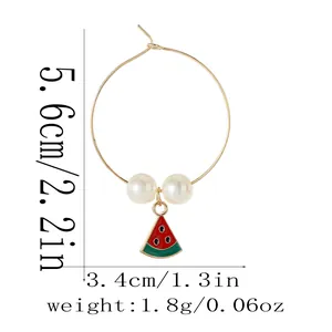 Detail view of gold alloy fruit charm earring with dimensions and watermelon pendant