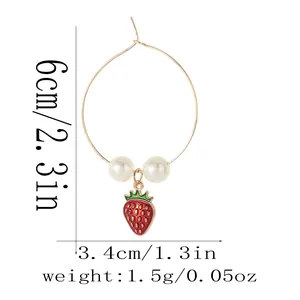Detail showing dimensions of gold-plated hoop earrings with pearl and strawberry charm