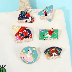 Detail of sports enamel pins including football and tennis on a canvas bag