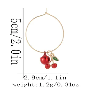 Detail shot of cherry bell earring with 5cm size markings on white background