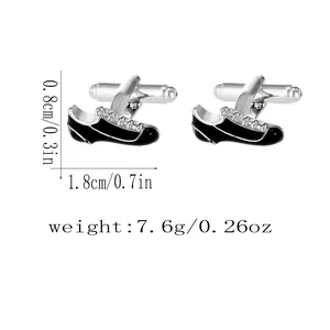 Detailed close-up of shoe-shaped enamel cufflinks with silver trim and size dimensions