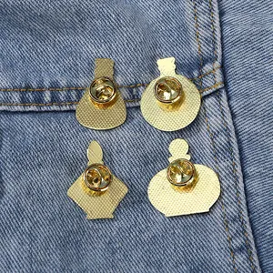 Golden four seasons flower vase metal pins set with butterfly clasps on denim fabric