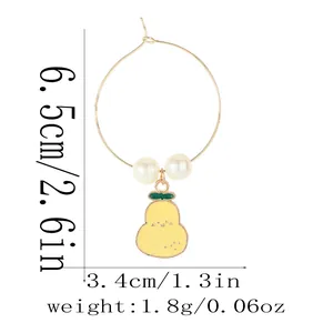 Detail showing dimensions of a gold fruit charm earring with white pearls and yellow pear