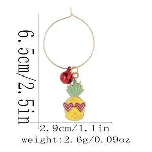 Detail showing dimensions of pineapple and bell earring measuring 6.5cm in height