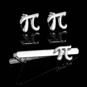 Close-up of polished silver 3D Pi symbol cufflinks and tie clip set on black mirror