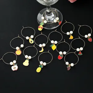 Detailed view of colorful fruit wine glass charms with enamel finish and white pearls