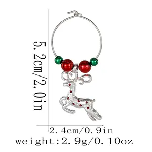 Christmas reindeer napkin ring featuring red and green beads on a silver metal hoop