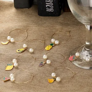 Detail of 8 fruit-themed wine glass charms with enamel pendants and faux pearls