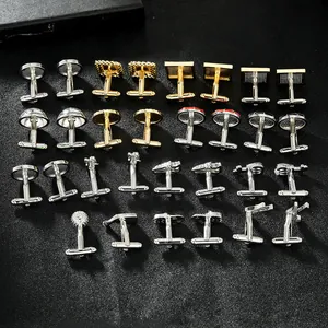Professional array of diverse geometric metal cufflinks displayed on a black textured background