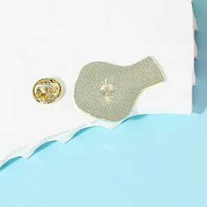 Back view of cute enamel snake brooch with golden metal butterfly clutch and pin detail