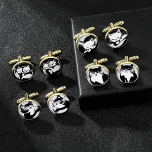Close-up of four pairs of gold cat cufflinks with glass domes on black leather display