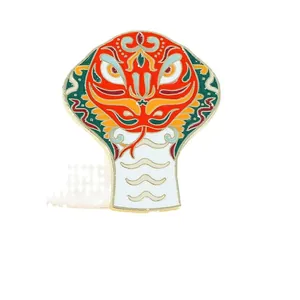 Colorful enameled snake brooch with traditional totem pattern and vibrant metal finishes