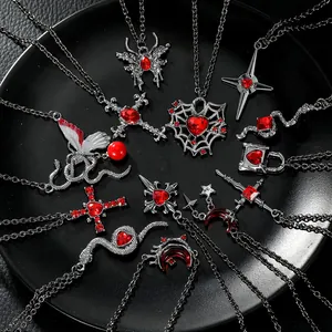 Gothic punk necklace set with vintage snake, butterfly, and cross pendants on black tray