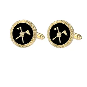 Golden golf cufflinks with black enamel featuring crossed clubs and a flag pattern