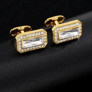 Macro view of gold rectangular cufflinks with zircon crystal inlay on black display