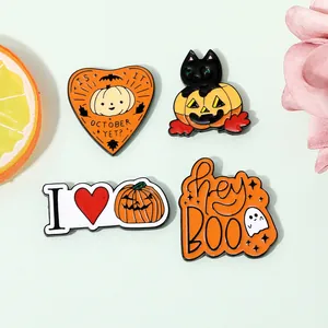 Detailed macro view of four festive Halloween enamel pins with cat and pumpkin designs