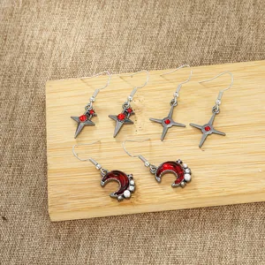 Retro punk set of silver alloy earrings with red crystals, crosses and crescent moon
