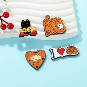 Detailed close-up of four Halloween enamel pins featuring black cat and pumpkin designs