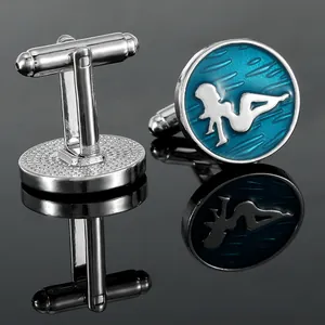 Men's silver-tone round cufflinks with blue ripple texture and female silhouette on black surface