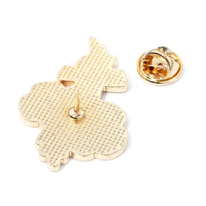 Golden flower pin badge back view showing textured metal surface and butterfly clutch