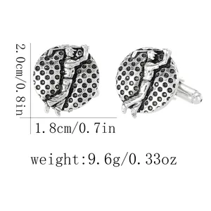 Detailed view of silver golf cufflinks featuring a golfer and textured metal base