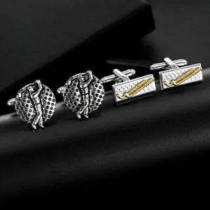 Detailed close-up of premium golf-themed cufflinks with silver and gold embossed textures