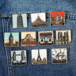 Detailed set of 10 square enamel pins featuring global city landmarks on denim fabric