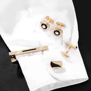 Golden business cufflinks and tie clip set with black enamel and sparkling crystals