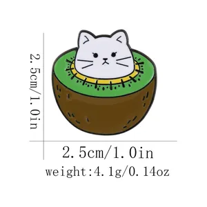 Detail showing dimensions of a white cat peaking out of a green kiwi enamel pin