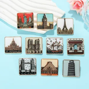 Detail of 10 square enamel pins featuring world landmarks like the Eiffel Tower and Big Ben