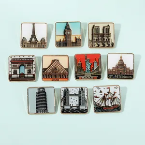 Detailed set of 10 vintage enamel city landmark pins with gold borders on a blue background