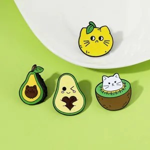 Set of four cartoon fruit cat enamel pins with lemon, kiwi and avocado designs