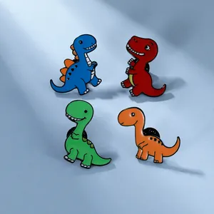 Lot de quatre pin's dinosaures colorés en émail, finitions bleue, rouge, verte et orange