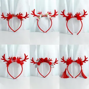 Set of six Christmas reindeer antler headbands with festive red bows and ornaments
