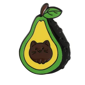 Cartoon enamel pin featuring a creative green avocado and brown cat head design