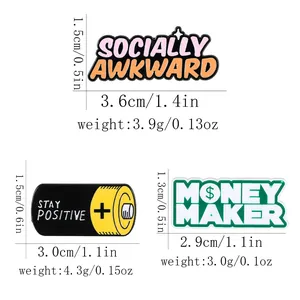 Three creative enamel lapel pins with battery and social text designs on white background
