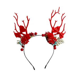 Christmas reindeer antler headband with red bow, berries and golden leaves decor