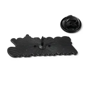 Black metal wave brooch back with secure butterfly clutch pin fastener on white background