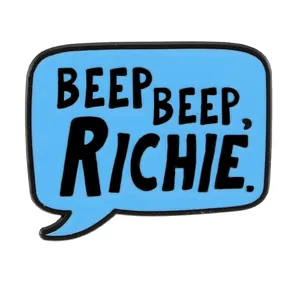 Sky blue enamel pin with Beep Beep Richie quote in geometric speech bubble shape