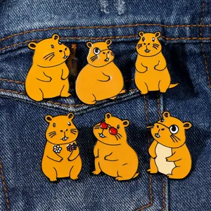 Set of 6 cute Capybara enamel pins with various poses on blue denim background