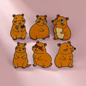 Macro detail of six cute cartoon Capybara enamel pins on a soft pink background