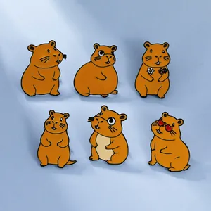 Set of six cute Capybara enamel pins with diverse cartoon poses on blue background