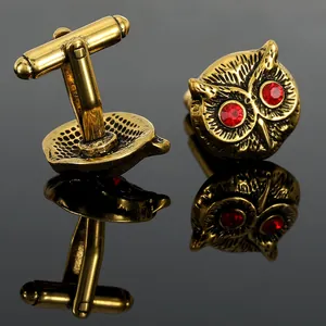 Vintage owl cufflinks with red rhinestone eyes in antique gold finish for formal shirts