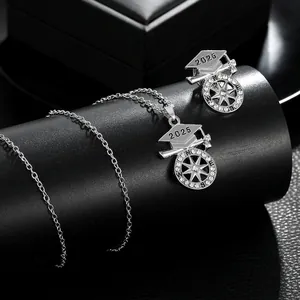Detailed shot of 2025 graduation cap necklace and brooch set with sparkling rhinestones