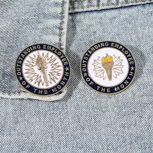 Golden employee of the month enamel lapel pins with torch icon on blue denim