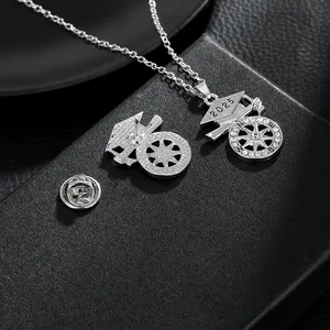 Silver 2025 graduation cap and compass jewelry set with crystal accents on black box
