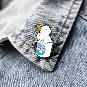 Cute cartoon duck enamel pin badge shown on a denim jacket lapel for decoration