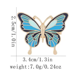 Insigne papillon en émail bleu et doré avec dimensions et mesures de poids